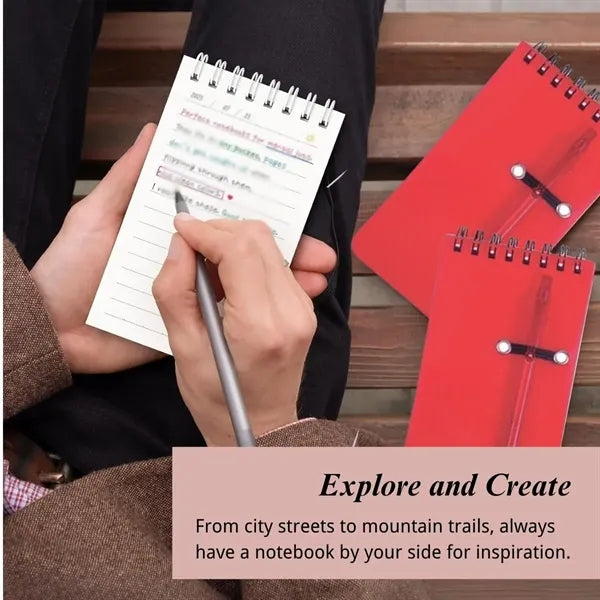 Small pocket spiral notebook with pen for office school