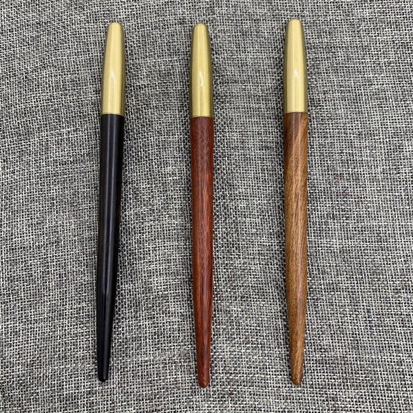Wooden roller pen with brass screw cap and sharp end