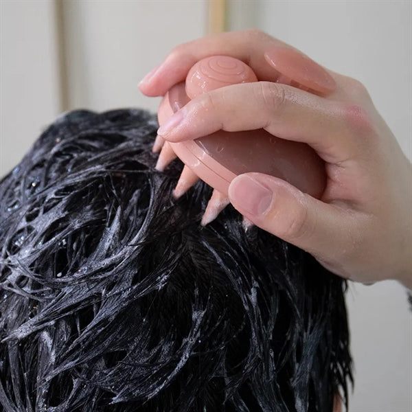 Silicone shampoo massage brush that presses out