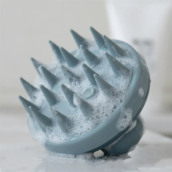 Silicone shampoo massage brush that presses out