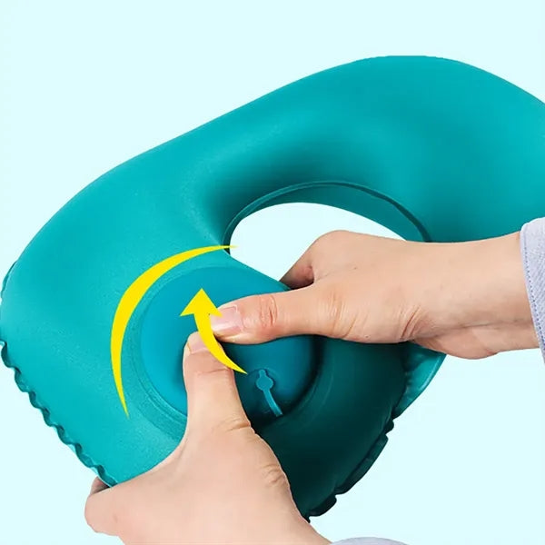 Manually pressable inflatable portable shrinkable pillow