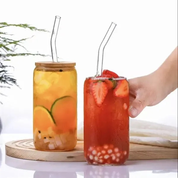 Bamboo-lidded glass cup with straw