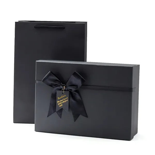 Black rectangular gift box with a bow decoration