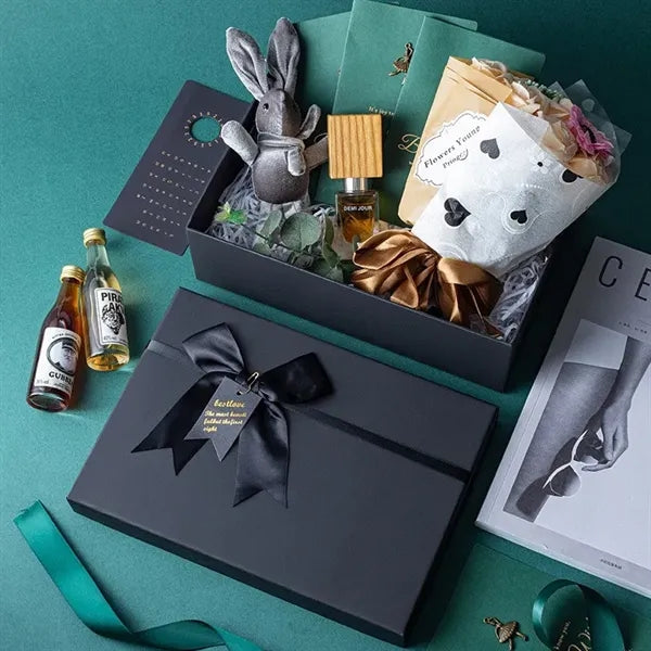Black rectangular gift box with a bow decoration