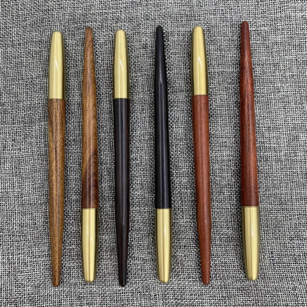 Wooden roller pen with brass screw cap and sharp end