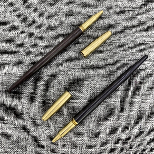 Wooden roller pen with brass screw cap and sharp end