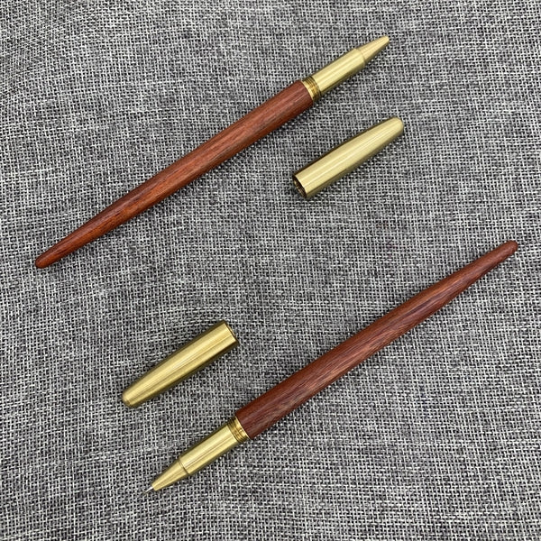 Wooden roller pen with brass screw cap and sharp end